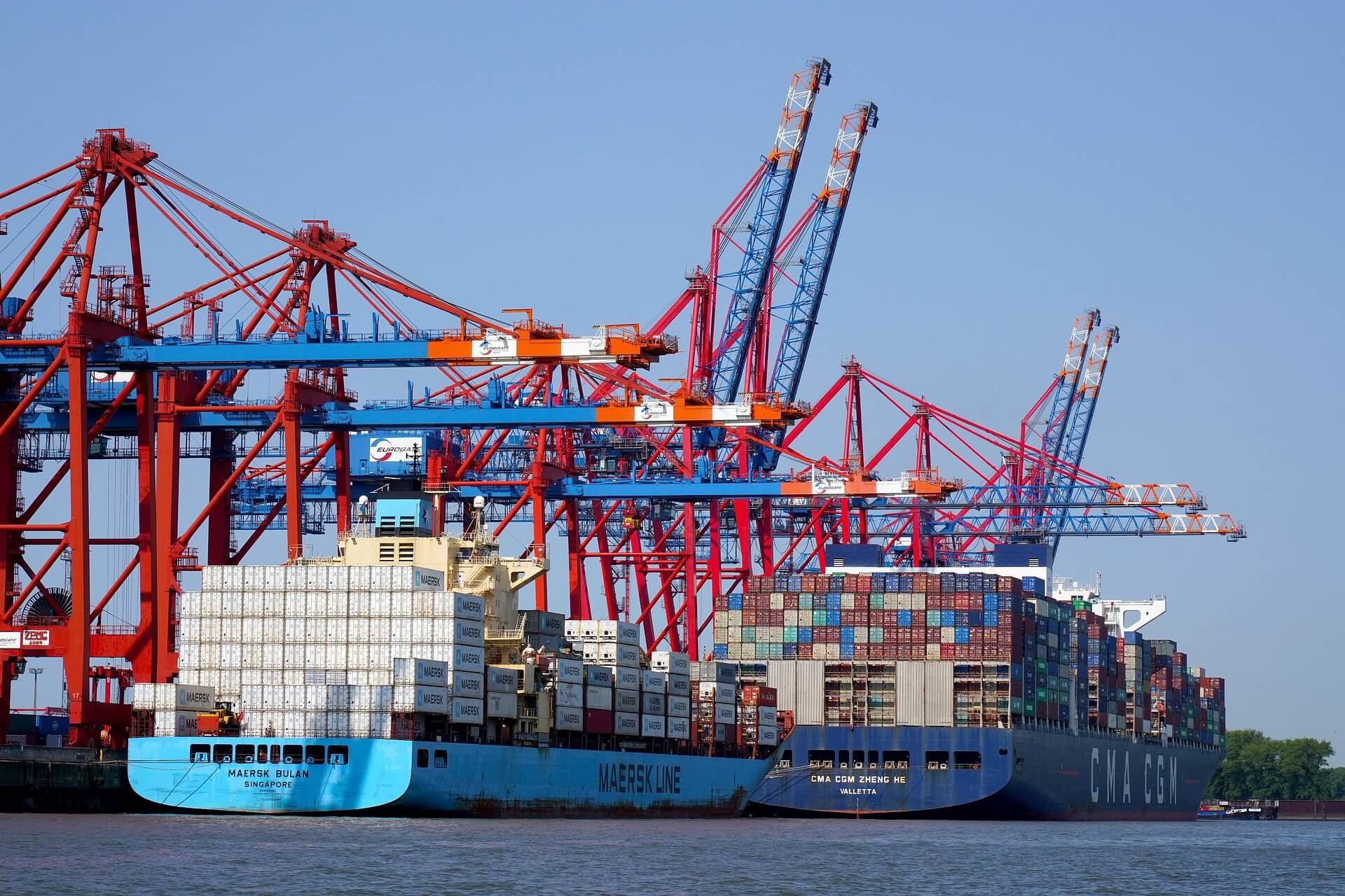 Port with cargo ships and cranes